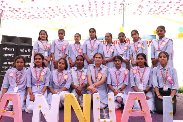 Girl Students Honored on Stage
